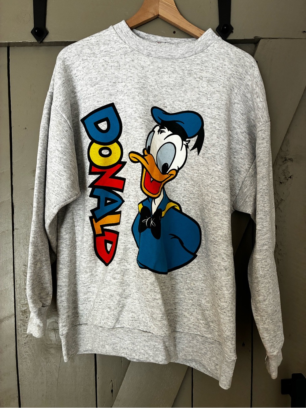 Disney Light Gray Crewneck Sweater with Colorful Donald Duck Graphic